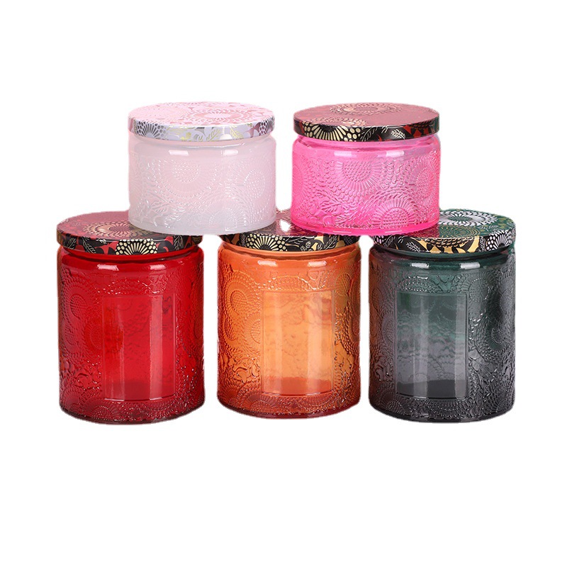 small flower pattern glass candle vessel with black tin lid